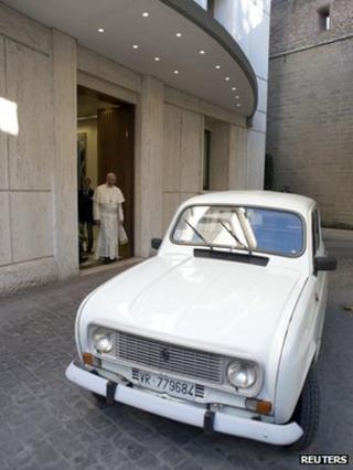 Pope Francis is presented with a Renault 4 car during a private audience with Don Renzo Zocca at the Vatican in this picture taken on 7 September 2013