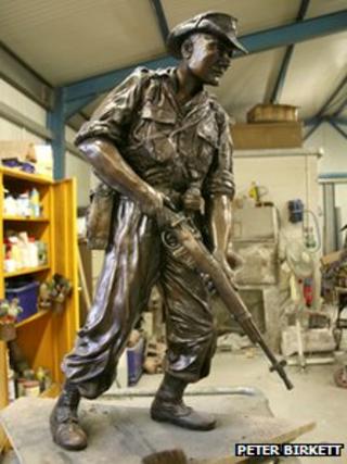 Bronze statue in artist's workshop