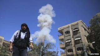 Free Syrian Army member fires a homemade mortar on one of the battlefronts in Jobar, Damascus on 15 September 2013