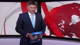 Simon McCoy holding a ream of A4 paper