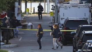 Investigators continue to work the scene at the Navy Yard two days after a gunman killed 12 people on 16 September 2013