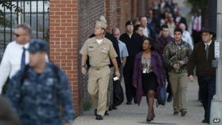 Military personnel and workers returned to work at the Washington Navy Yard on 19 September 2013