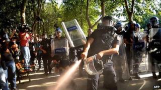 Riot police use tear gas to disperse demonstrators in Gezi Park. 8 July 2013