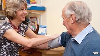 Man getting blood pressure taken by his GP