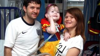 Maisie Harris and her parents