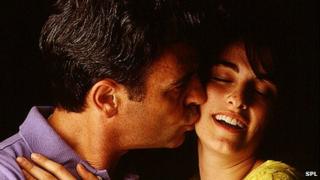 Man kissing a woman