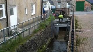 New metal screens are fitted on the culvert to stop the Nant Barrog stream getting blocked