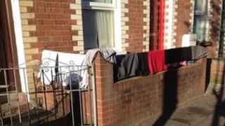 Clothes drying on wall