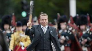 Chris Hoy with Commonwealth Games Baton