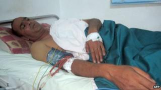 A wounded police officer receives the first treatment in a hospital in Sidi Bouzid on October 23, 2013