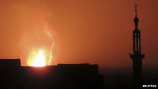 Smoke rises after what activist said was a fire near Damascus International Airport October 23, 2013
