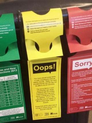 Tags put on recycling bins
