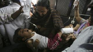 Indian villagers, injured in what witnesses said was firing from the Pakistan side of the border, are taken to a hospital in Jammu October 24, 2013