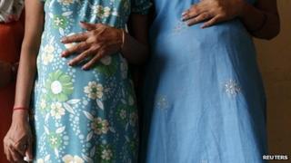 Two pregnant surrogate mothers