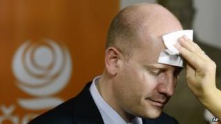 A make-up artist prepares Social Democrat leader Bohuslav Sobotka for a TV appearance as results come in
