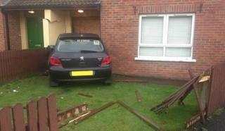 car crashed into house