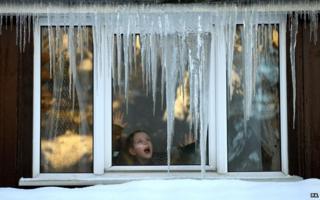 Girl at frosty window