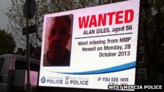 TV van displaying image of Alan Giles