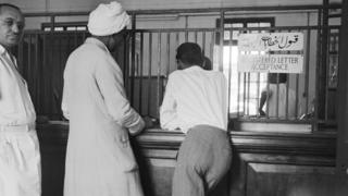 Customers waiting at the registered letter counter of the General Post Office at Khartoum (1950)
