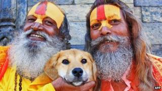 Rupee posing with Hindu saddhus (holy men) in Kathmandu