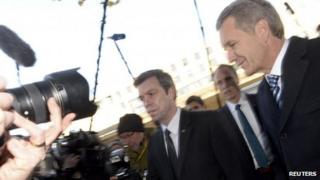 Germany's ex-President Christian Wulff (right) arriving for his trial at the regional court in Hanover (14 November)