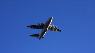 Plane taking off in clear blue skies
