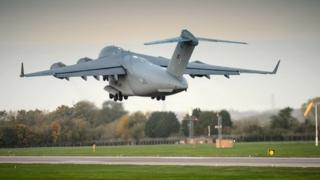 Handout photo issued by the Ministry of Defence of a Royal Air Force 99 Sqn C-17 transport plane as it departs RAF Brize Norton in Oxfordshire