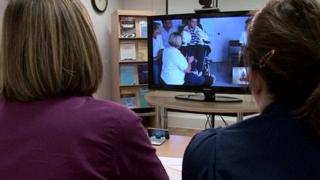 Doctors and patients using telemedicine