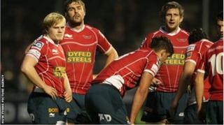 Scarlets players at end of Saracens