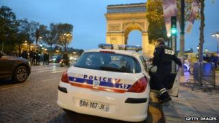 French police officers patrol on the Champs Elysees in Paris