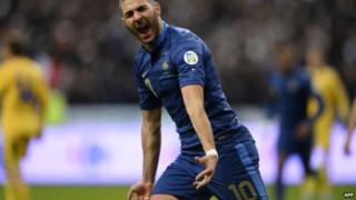 France's forward Karim Benzema celebrates after scoring his team's second goal