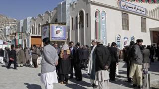 Members of Afghan Loya Jirga outside venue in Kabul