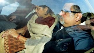 Rajesh Talwar and his wife Nupur Talwar are driven away in a police van after the verdict