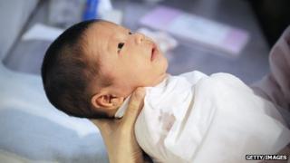 A baby wrapped in towel at a Beijing hospital