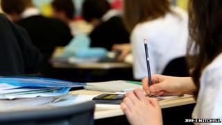 Exam pupil's hand