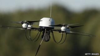 A surveillance drone flies near Munster, Germany, on October 2, 2013.