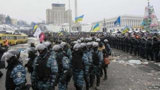Riot police leave Independence Square in central Kiev on Wednesday