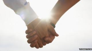 Holding hands - stock image