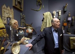 French auctioneer Alan Leroy stands during an auction of sacred objects from the Hopi and San Carlos Apache Native American tribes in Paris, 9 December
