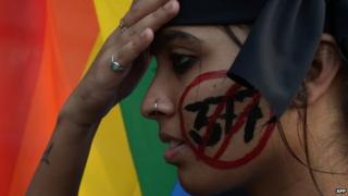 An Indian gay-rights activist takes part in a protest against the Supreme Court ruling reinstating a ban on gay sex in Kolkata on December 11, 2013