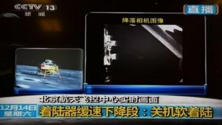 This screen grab taken from CCTV live broadcasting footage shows an image (R) of China"s first lunar rover transmitted back to the control centre in Beijing after it landed on the moon on December 14, 2013.