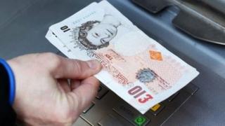 Man withdrawing cash from ATM