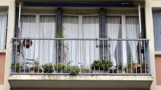 The balcony of the flat where the bodies of two children, aged five and 10, were discovered.