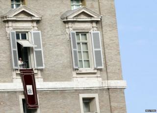 Pope Francis addresses pilgrims from a balcony above St Peter's Square, 1 January