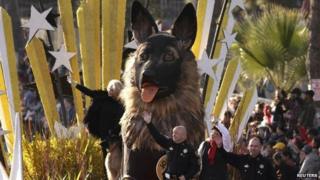 Law enforcement officers ride on the K9s4Cops float at the Rose Parade in Pasadena, California