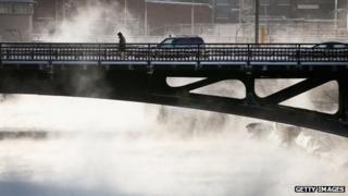 A commuter crosses the Chicago River in Chicago, Illinois, on 6 January 2014