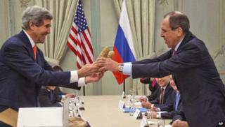 US Secretary of State John Kerry (left) gives a pair of Idaho potatoes to his Russian counterpart Sergei Lavrov