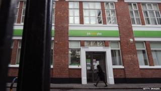 LONDON - OCTOBER 21: A woman walks by a Job Centre in Westminster on October 21, 2010