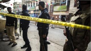 Security officials cordon off the site of a suicide blast in Rawalpindi, 20 January 2014