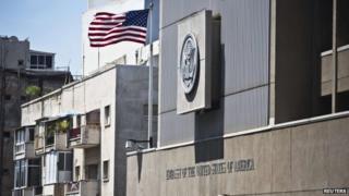 A flag flutters outside the US embassy in Tel Aviv